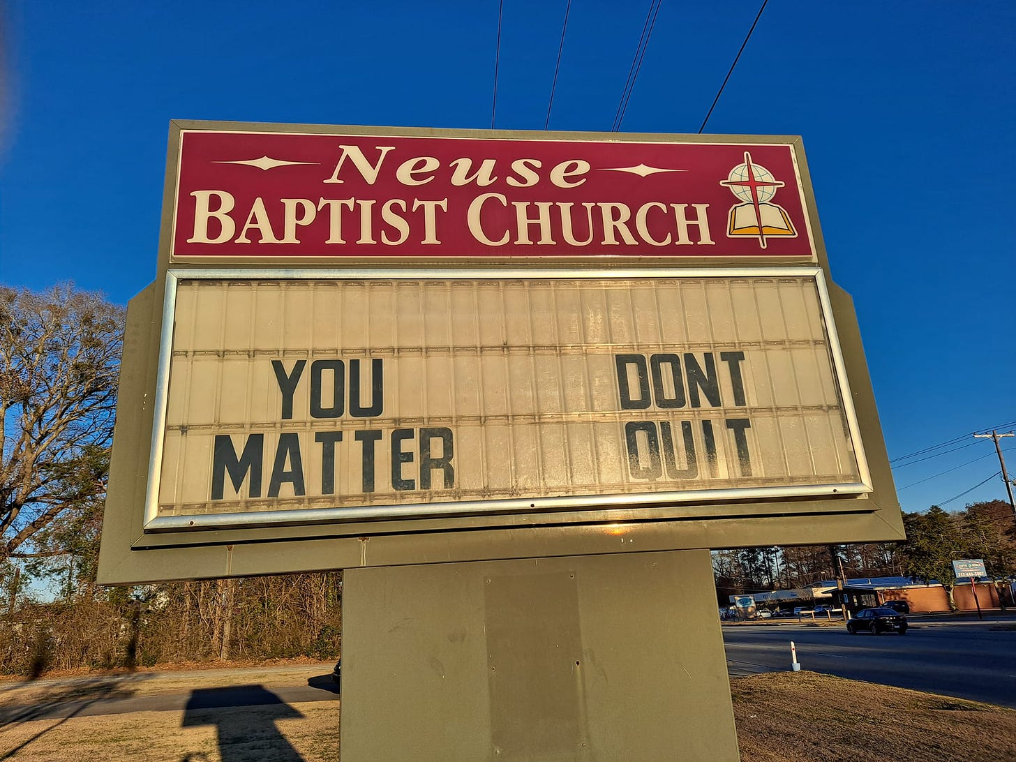 May be an image of outdoors and text that says 'Neuse BAPTIST CHURCH YOU MAT TER DONT QUIT'