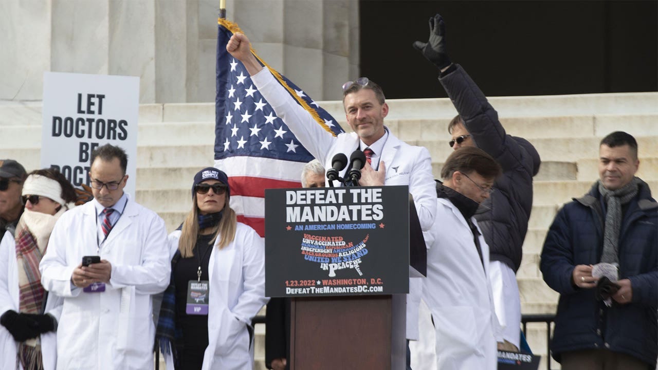  A photo of Ryan Cole, MD, speaking at a Defeat The Mandates rally in Washington, DC.