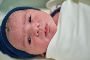 Newborn baby in swaddling