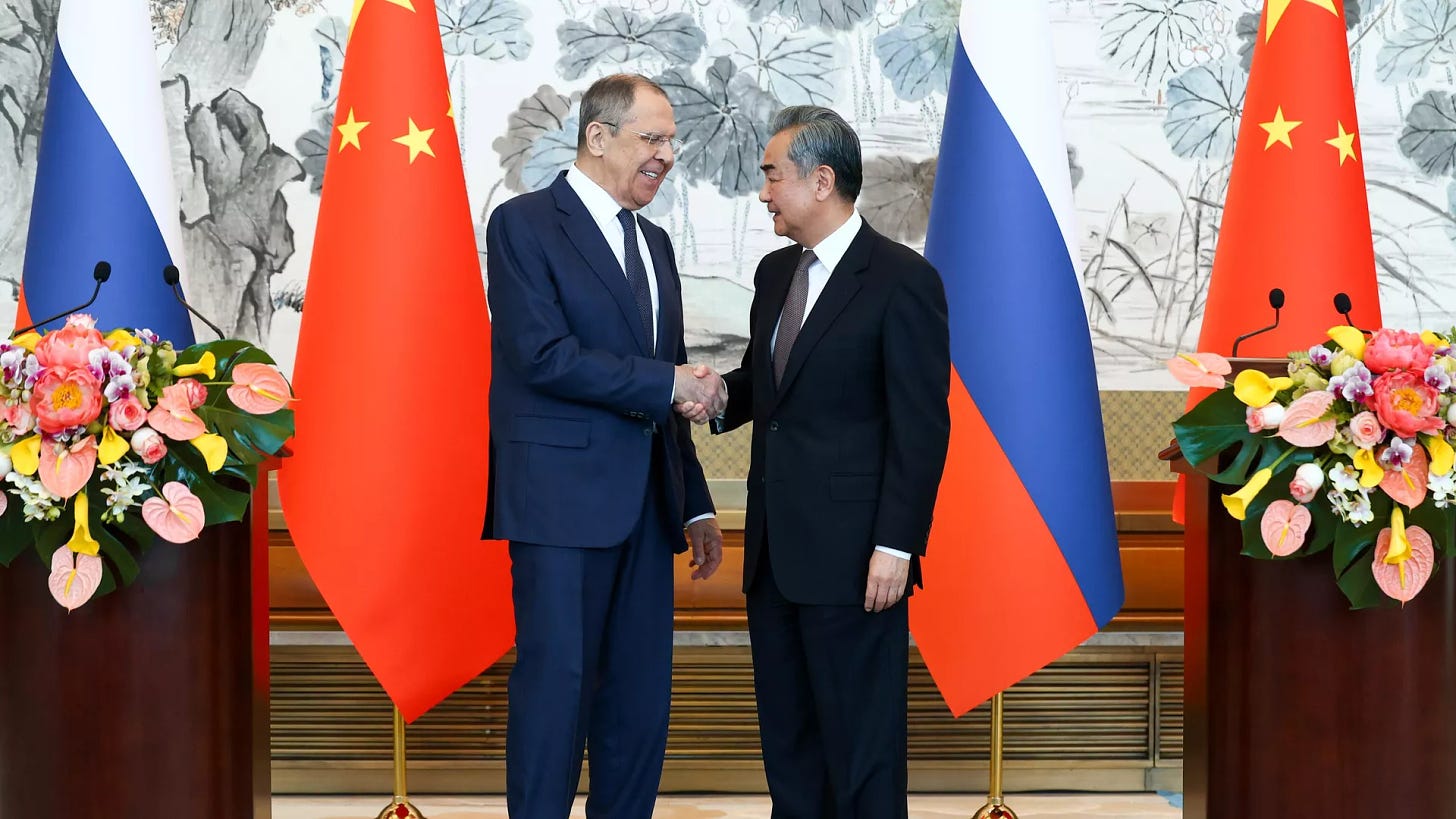 Russian Foreign Minister Sergey Lavrov and Chinese Foreign Minister Wang Yi shake hands during a joint press conference following their meeting at the Diaoyutai State Guest House in Beijing, China - Sputnik International, 1920, 10.04.2024