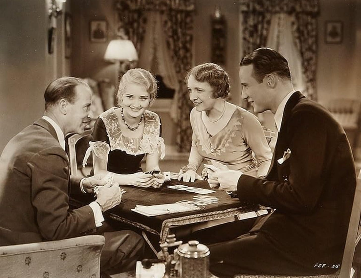 H.B. Warner, Marian Marsh, Frances Starr, and Anthony Bushell in a scene from Five Star FInal