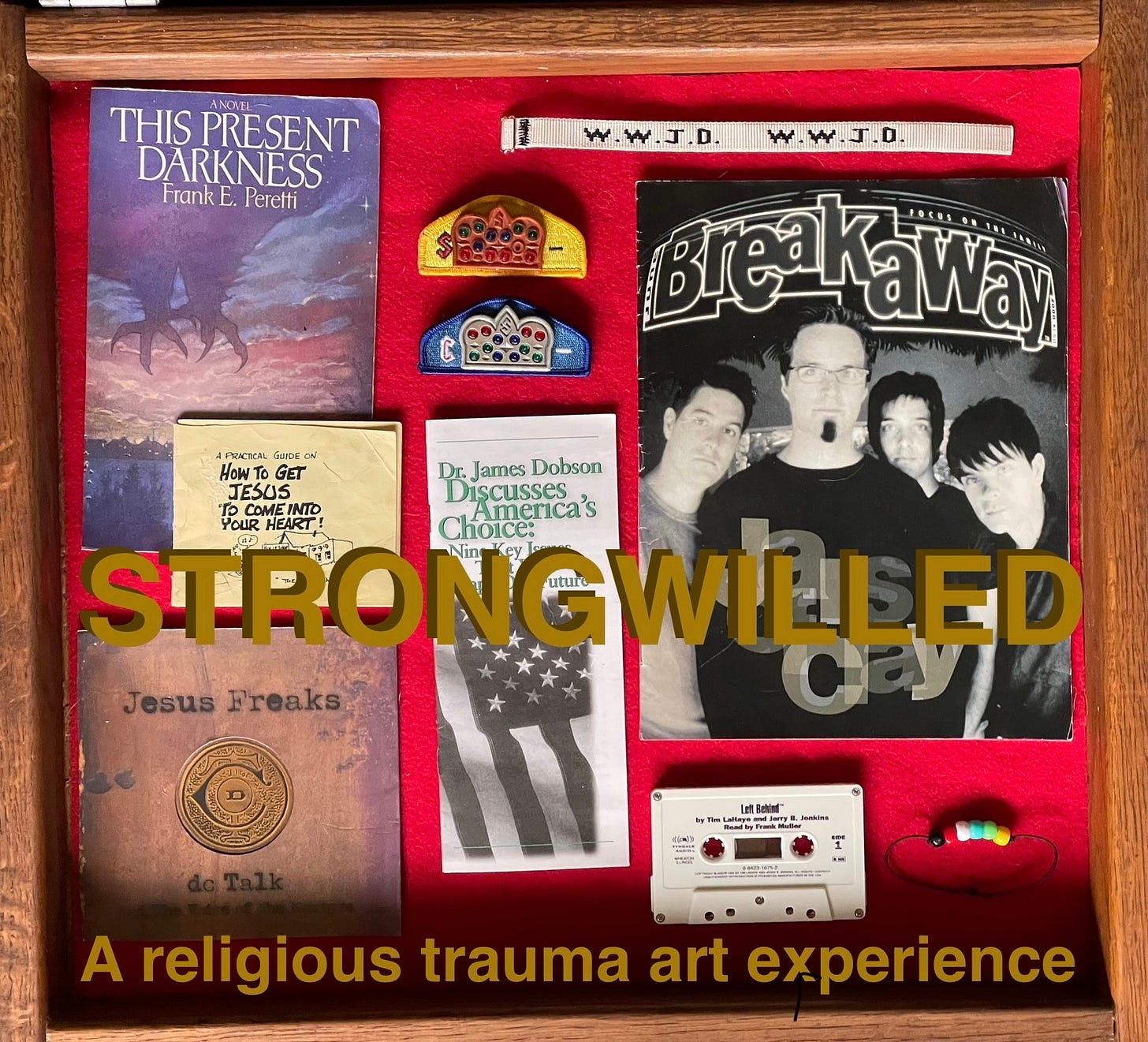 a wooden box with a red background has an assortment of evangelical artifacts on it like wwjd bracelets, a jesus freaks album, this present darkness by frank peretti, and more. text says strongwilled a religious trauma art experience