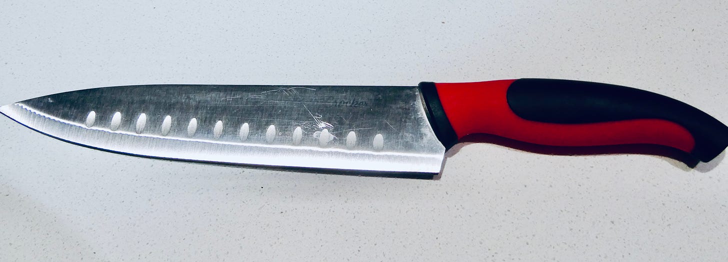 Chef knife with red and black handle