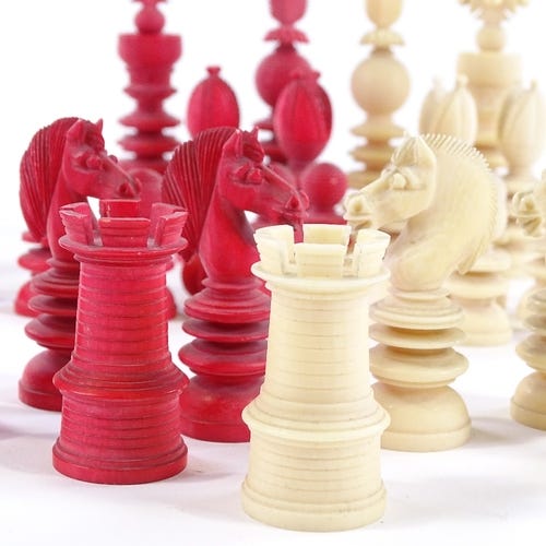 Selection of red and white chess pieces