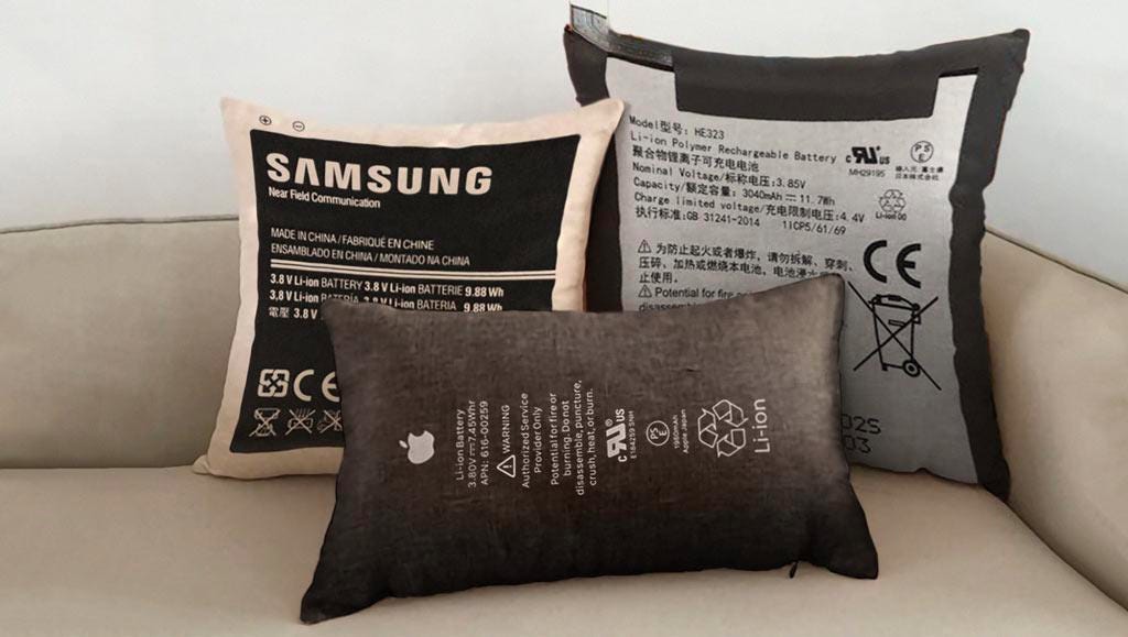 pillows with battery graphics printed on them