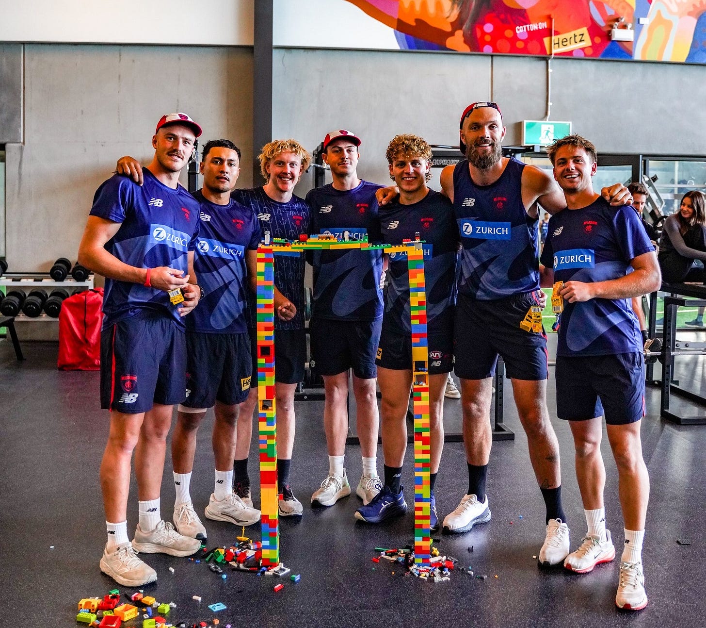 May be an image of 10 people, people playing tennis and text