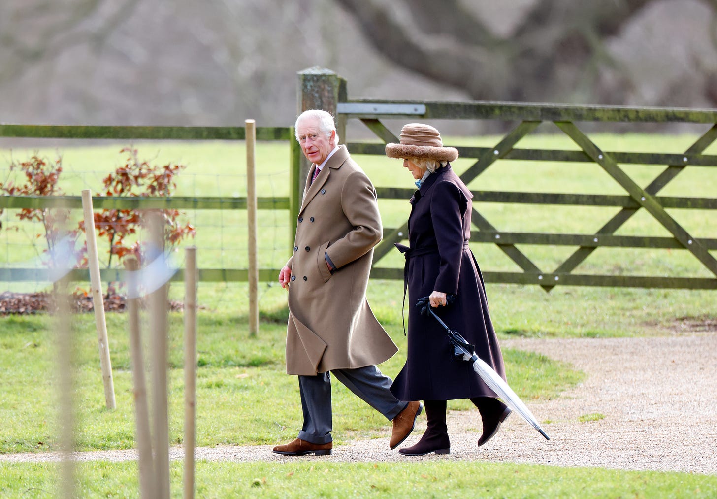 King Charles and Queen Camilla walking on the Sandringham estate