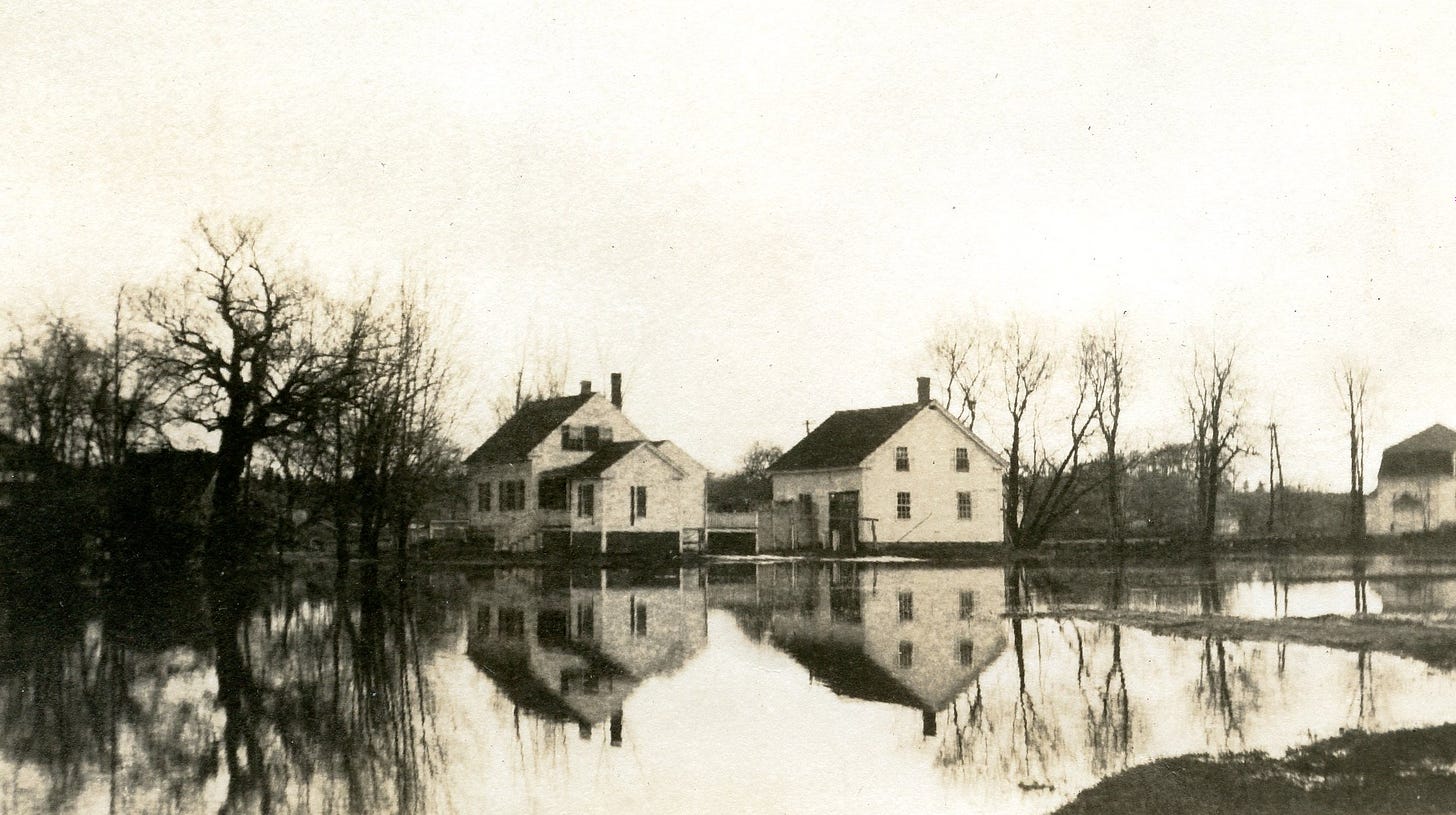 flooded field with two buildiings