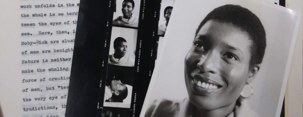 Black and white images of Hortense Spillers alongside papers of type written text.