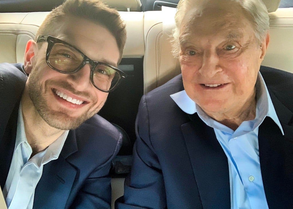 George Soros and Alexander Soros in the back of a car 