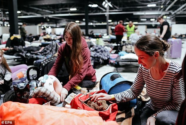 Ukrainian refugees at the Humanitarian Aid Center at the Ptak Warsaw Expo in Nadarzyn, near Warsaw, Poland, shortly after Putin's troops invaded Ukraine