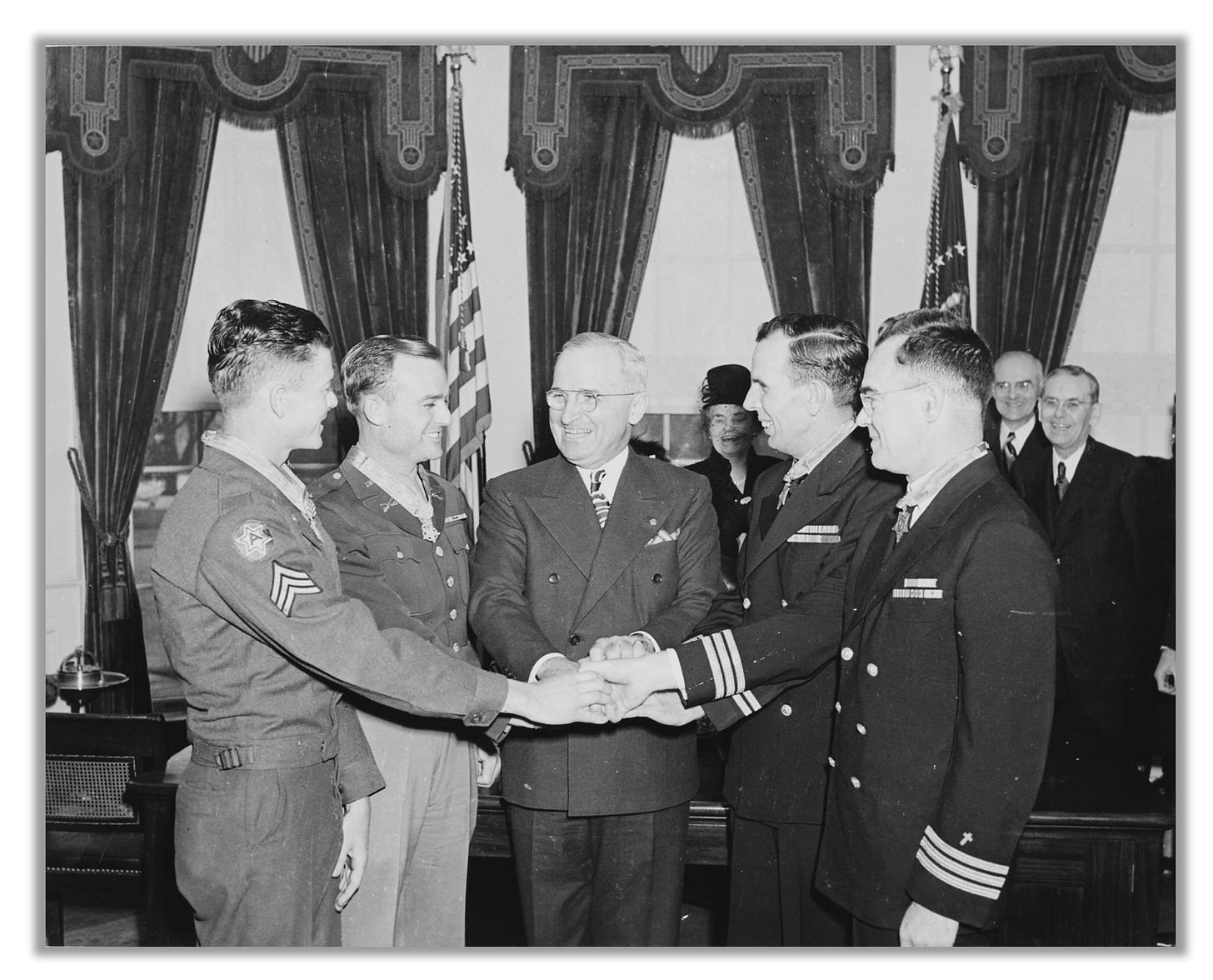 Harry Truman is shown with four Medal of Honor recipients: John McKinney, Daniel Lee, Donald Gary, and Joseph O'Callahan.