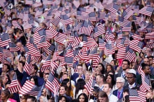 Delegates wave US flags on the fourth and last day of the Democratic National Convention