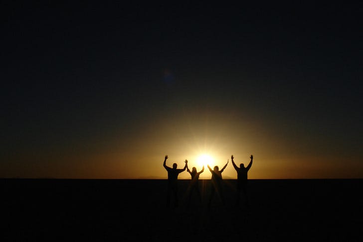 Royalty-Free photo: Silhouette of four person raising hand during sunset |  PickPik