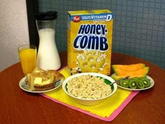 A 'complete' and 'balanced' breakfast from the 90s. Buttered toast, a  carafe of milk, a large bowl of sugary cereal, two kinds of fruit and a  glass of orange juice. 🥲 :