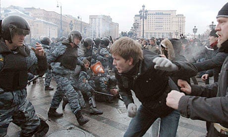 Football fans clash with riot police in central Moscow during a rally in memory of Yegor Sviridov