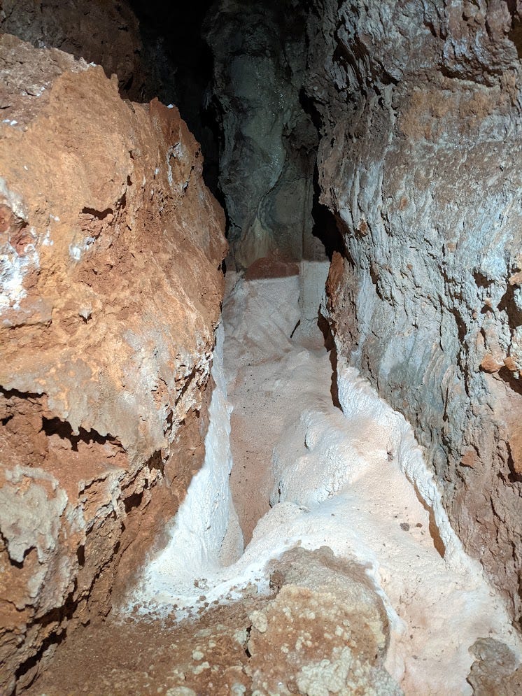 Tall canyon passage with the Snowy formation covering the bottom half