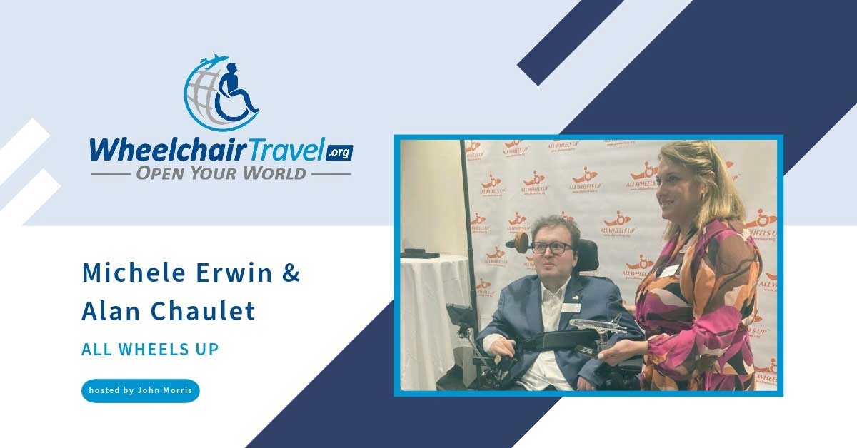 Photo of Alan seated in his wheelchair next to Michele who is standing.