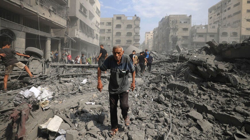 Palestinians evacuate the area following an Israeli airstrike on Sousi Mosque in Gaza City, Gaza Strip, Oct. 9, 2023.