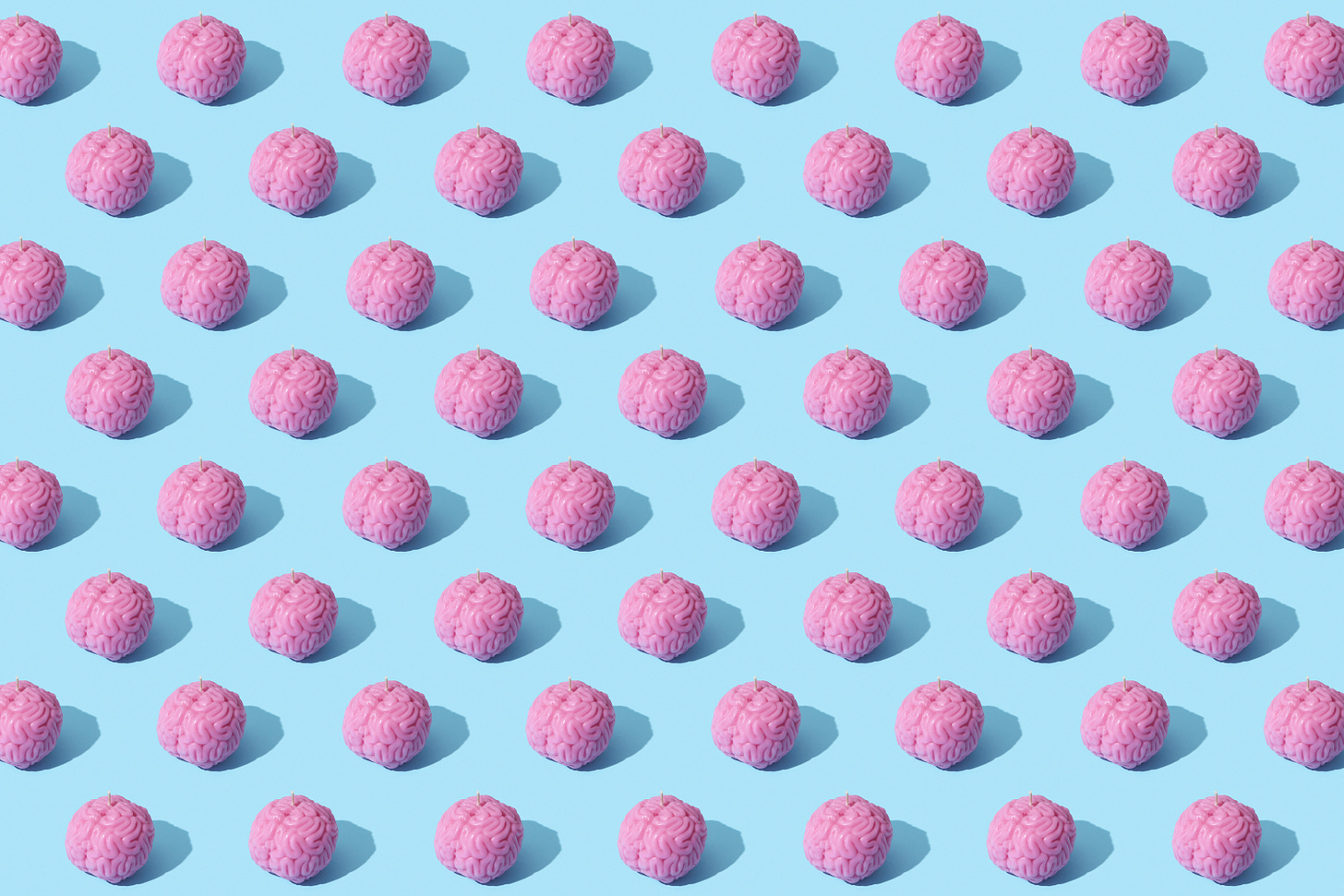 50-70 pink brains tiled on a pale blue background