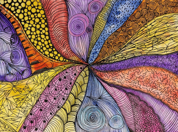 Colourful ink and colour patterned doodles radiating out from centre