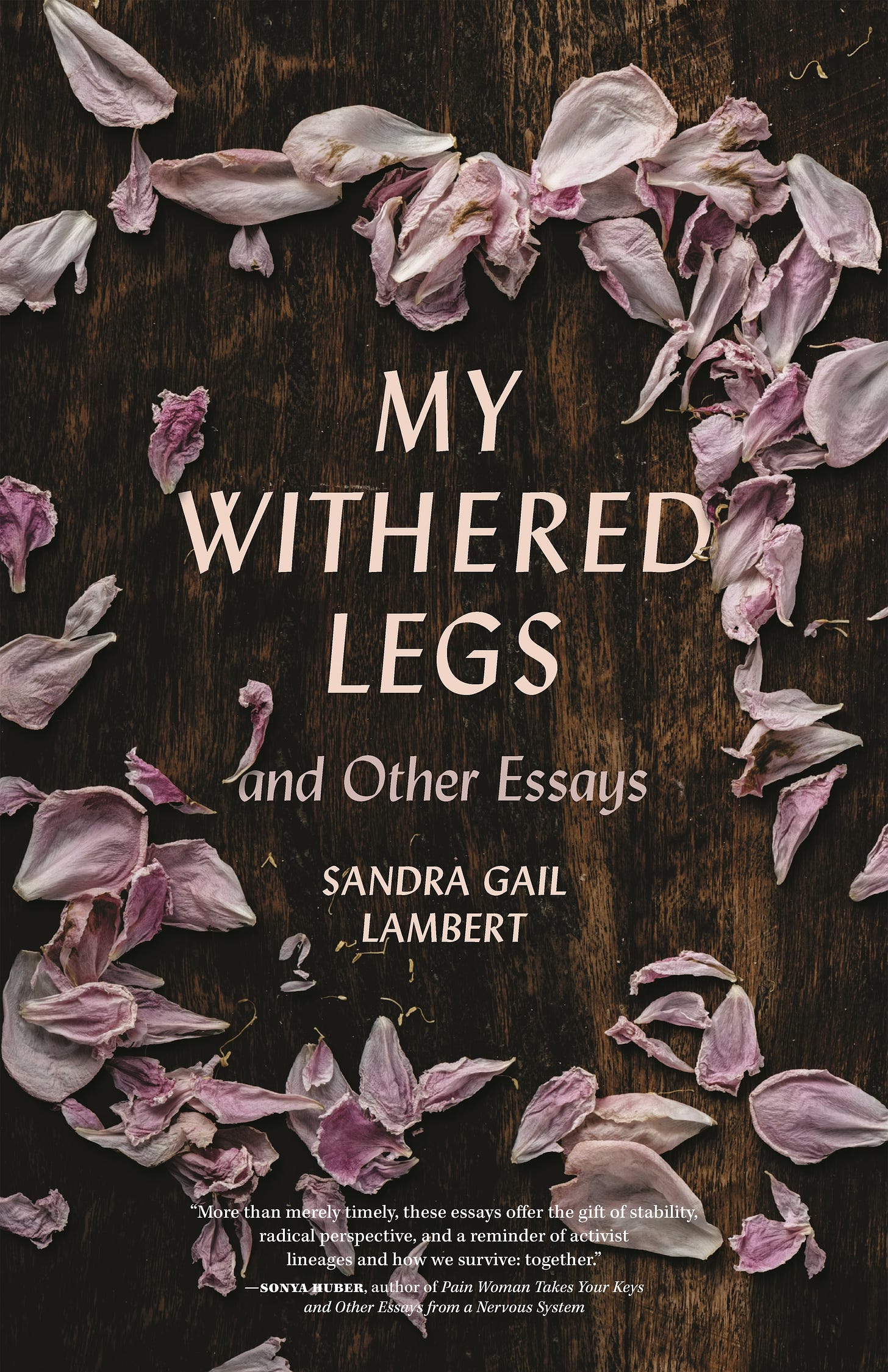 A book cover. The text says "My Withered Legs and Other Essays, Sandra Gail Lambert. There is a loose circle of purple petals around the text and a brown, tree bark like background. 