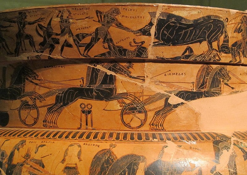 Close uup of the Francois vase, a black figure vase. The second band on side A shows the chariot race which is part of the funeral games for Patroclus, instituted by his friend Achilles, in the last year of the Trojan War. Here, Achilles is standing in front of a bronze tripod, which would have been one of the prizes, while the participants include the Greek heroes Diomedes and Odysseus. 