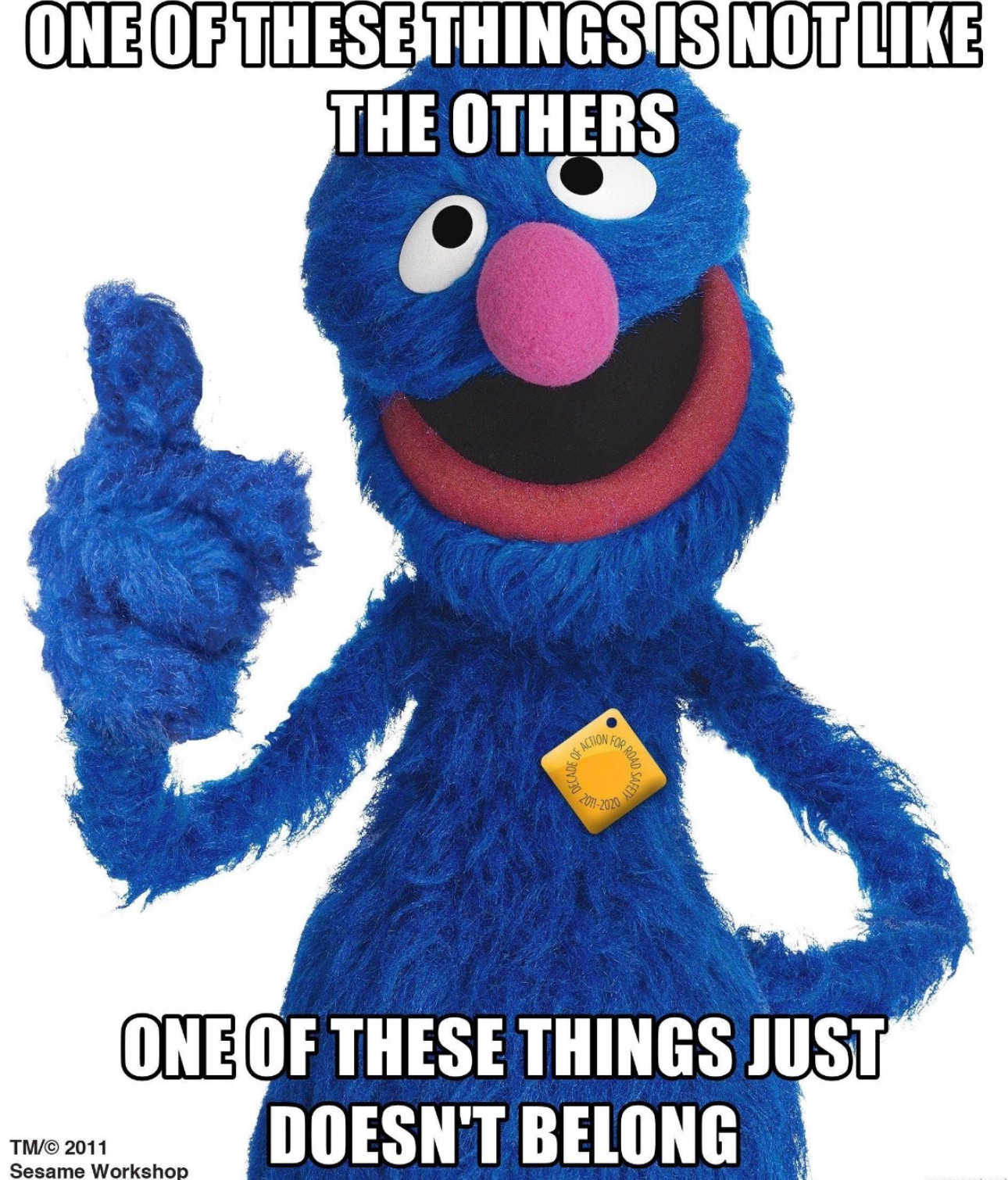 A blue puppet with a thumbs up

Description automatically generated