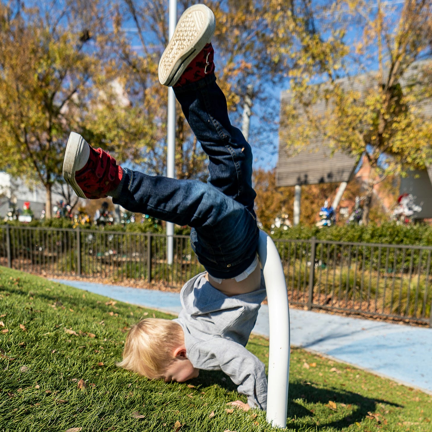 Child doing a face-plant in a park