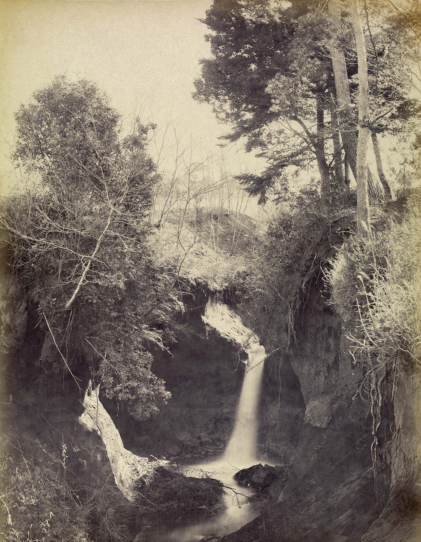 Albumen print by Felice Beato of Jūnisō's main waterfall, ca. 1863–1868