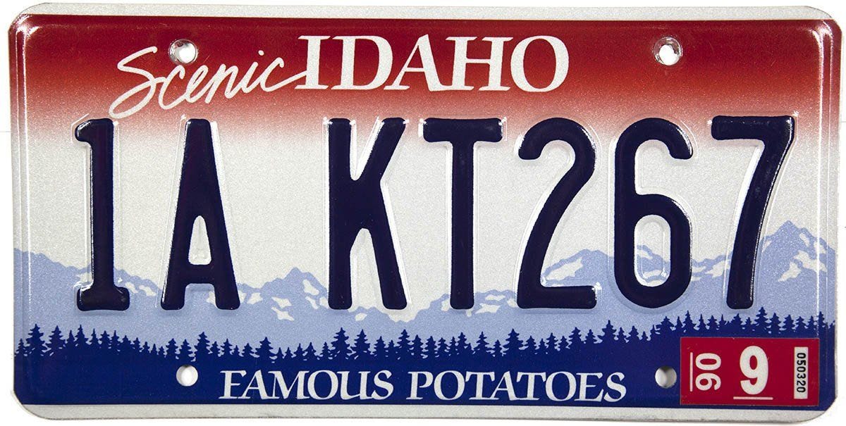 Idaho license plate. At the top it says Scenic IDAHO. Along the bottom it says FAMOUS POTATOES.