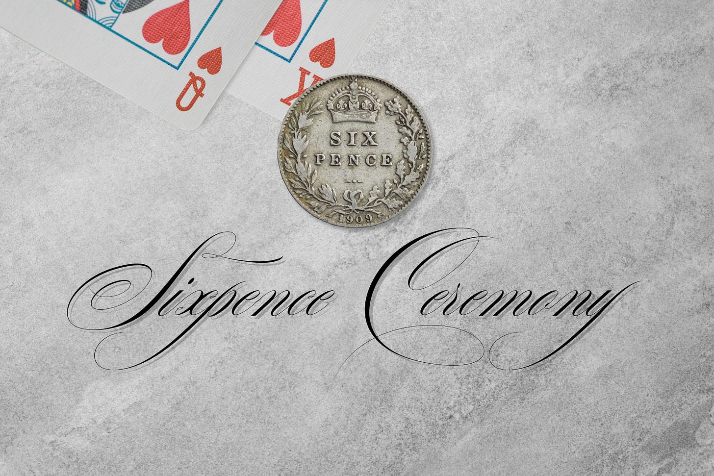 Two playing cards (the King and Queen of Hearts) and a Victorian silver sixpence with the words Sixpence Ceremony below them
