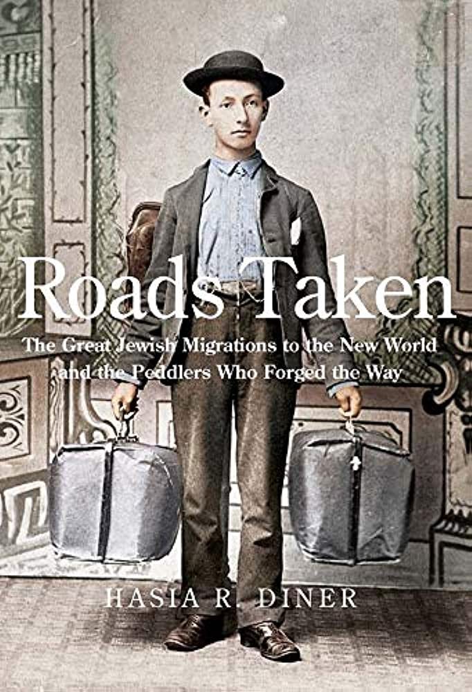 Roads Taken cover, featuring a young man in 19th century dress carrying two large packs. 