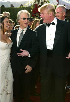 Bill Maher and Donald Trump are seen chatting at the 56th annual Primetime Emmy Awards at the Shrine Auditorium on Sept. 19, 2004, in Los Angeles.