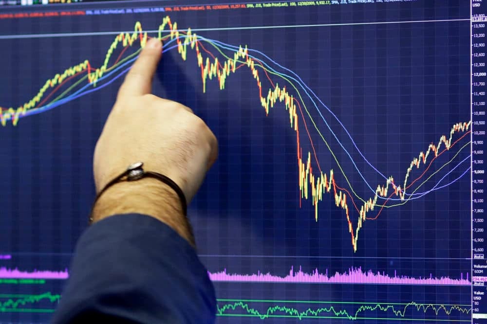A trader follows a chart at the New York Stock Exchange. (Mark Lennihan, File/AP)