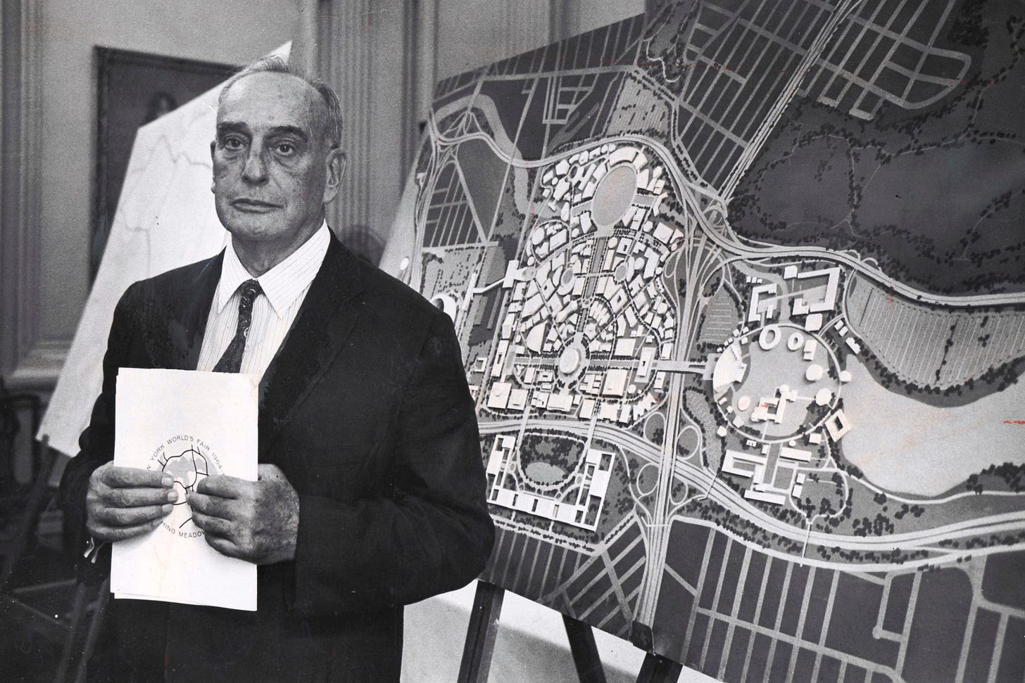 Robert Moses in 1960, in front of a display of plans for the 1964 New York  World's Fair, one of the innumerable marks he left on the city.