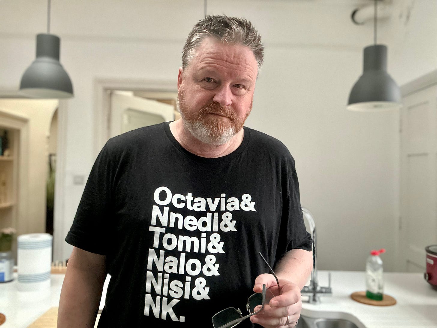 Gareth standing in his kitchen, staring into the camera in a way he hopes is "professional but friendly"