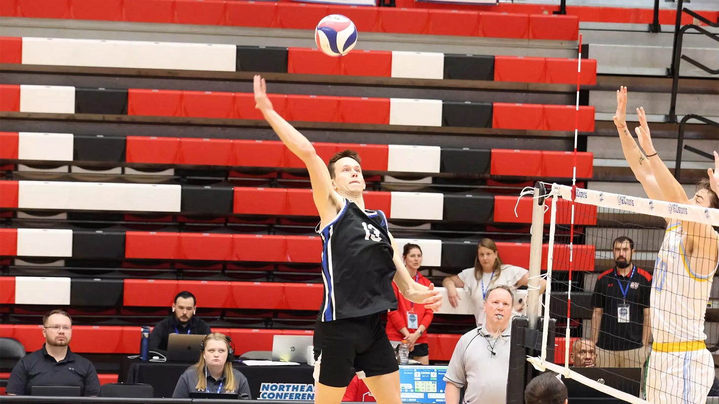 Zach Schneider goes for a kill against LIU Zach Schneider goes for a kill against LIU
