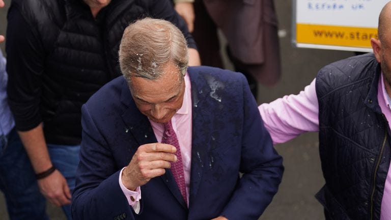 Nigel Farage has a drink thrown over him as he leaves the Moon and Starfish pub.
Pic: PA 