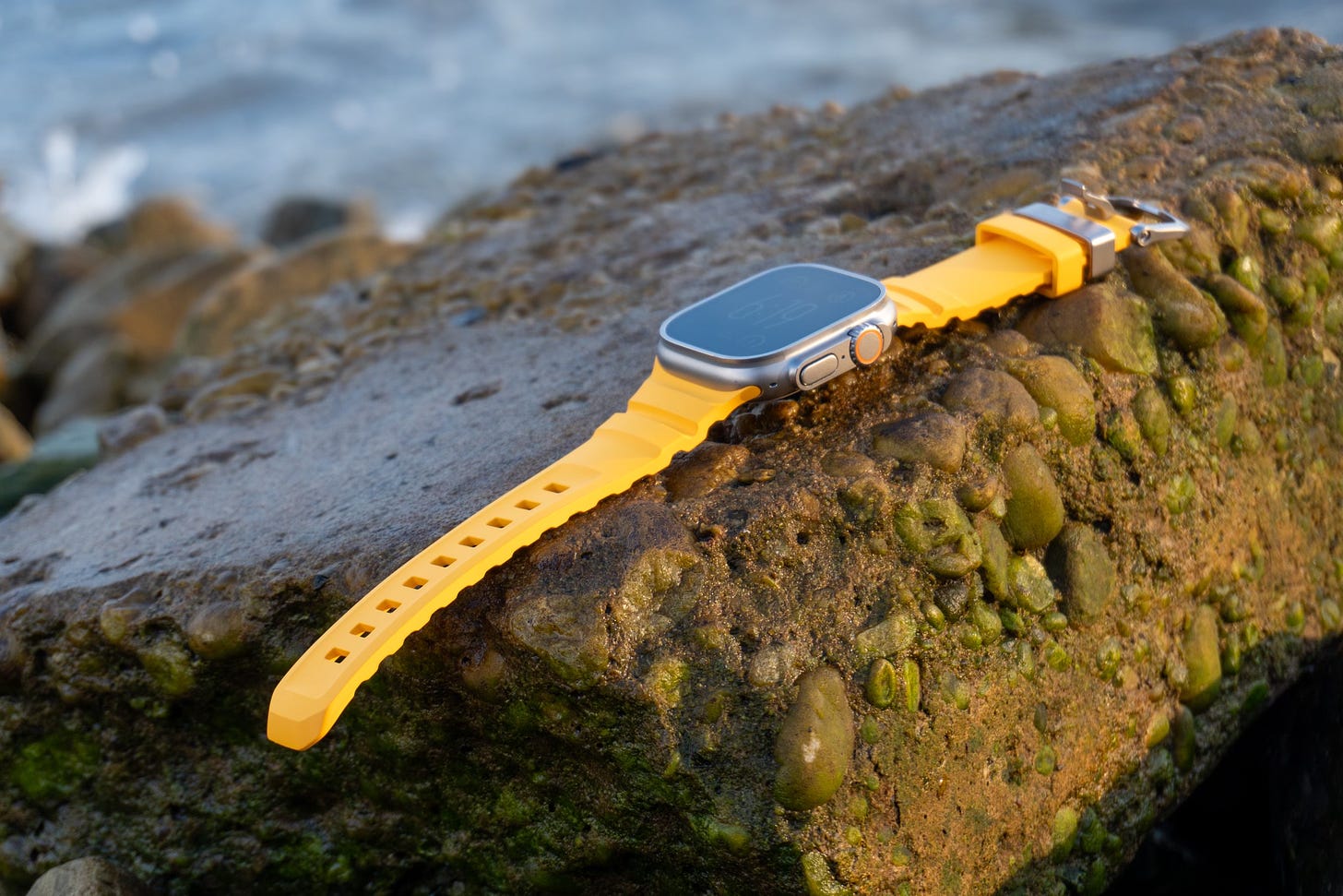 Nomad's Rocky Point band for Apple Watch Ultra in Soli on a rock.