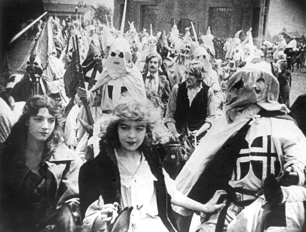 Actress Lillian Gish is at the head of a huge group of hooded KKK men in D.W. Griffith's 1915 epic film The Birth of a Nation