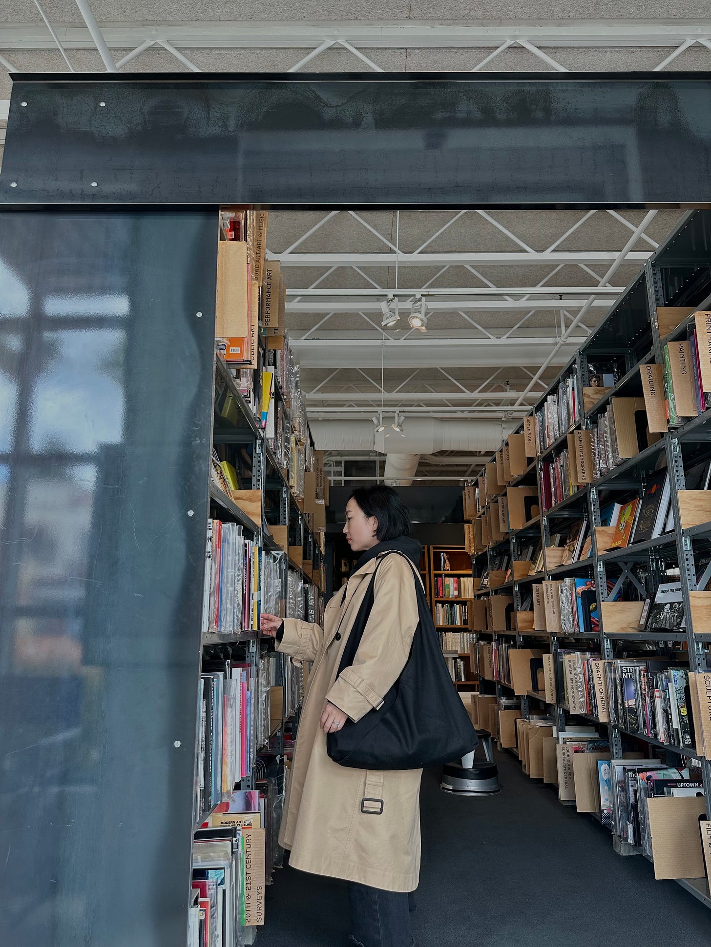 trench coat with books