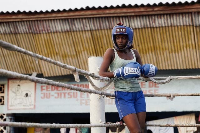 The image shows Safi Nadege Lukambo, a female boxer from Kinshasa