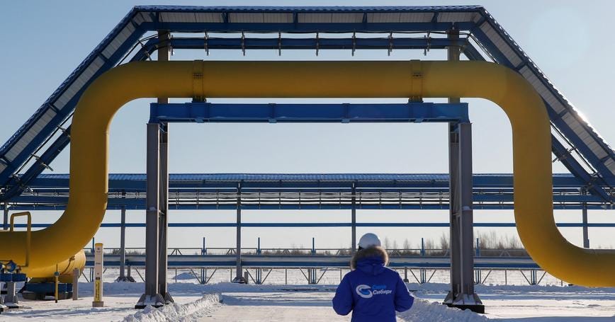 An employee walks past a part of Gazprom's Power Of Siberia gas pipeline at the Atamanskaya compressor station outside the far eastern town of Svobodny, in Amur region, Russia, November 29, 2019, photo by Maxim Shemetov/Reuters