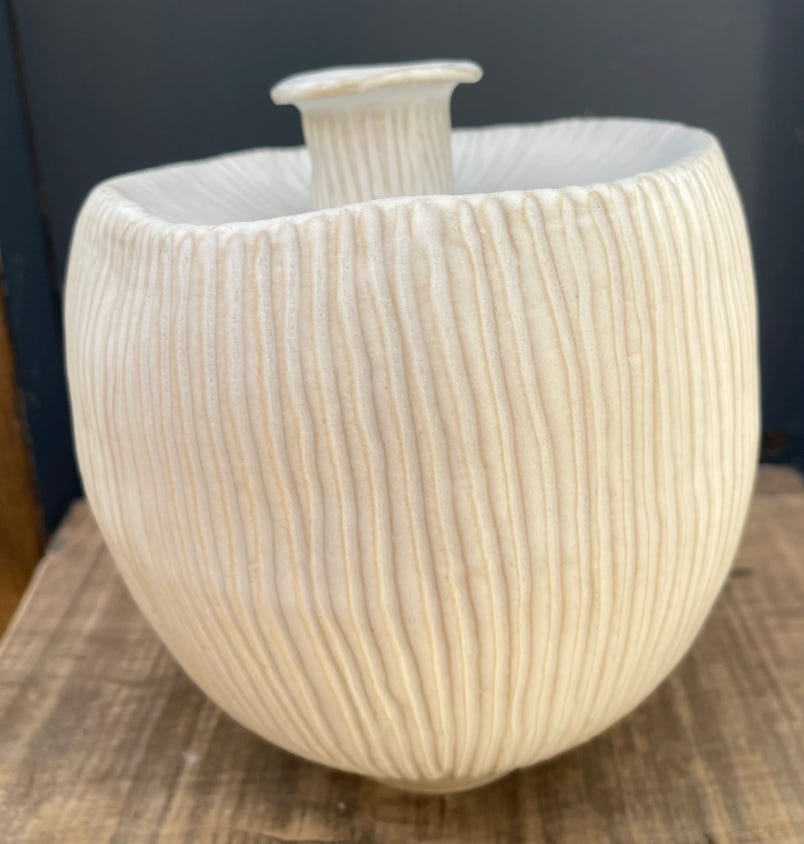 stoneware vase with ergonomic shaping