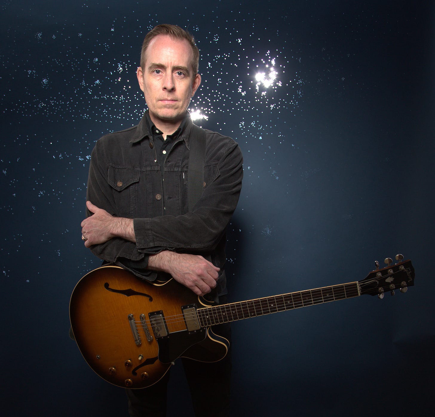 Picture of Ted Leo with sunburst colored guitar