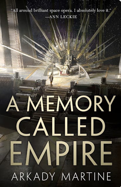 The cover of A Memory Called Empire by Arkady Martine. It features a view of a futuristic throne room, the dominant colours of the image and text are black and gold.