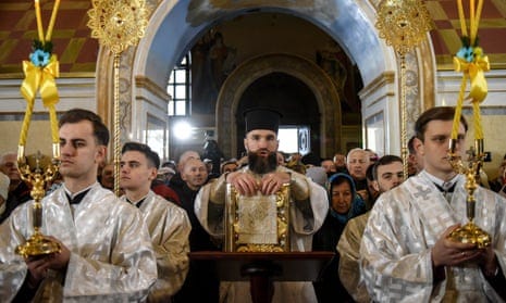 Priests attend the Christmas divine service celebrated by Metropolitan Epiphanius, the head of the Orthodox Church of Ukraine, at the Assumption Cathedral in Kyiv-Pechersk Lavra in Kyiv, Ukraine, 07 January 2023.