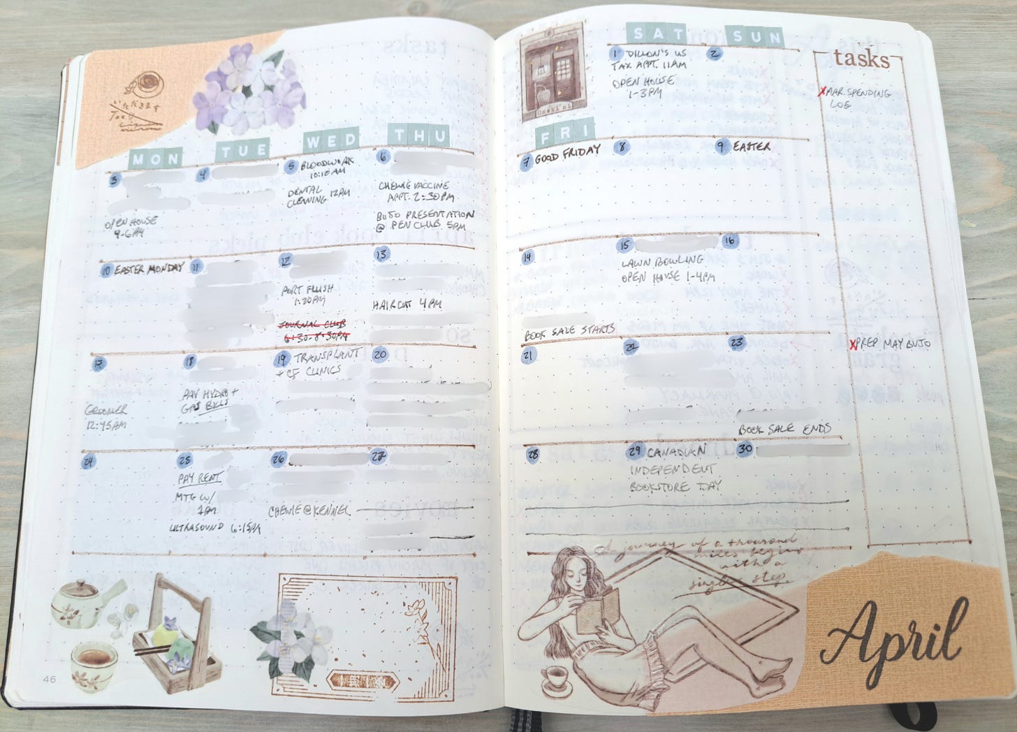 Hand drawn calendar in notebook decorated with paper, stickers, and stamps.