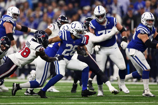 Jonathan Taylor of the Indianapolis Colts carries the ball during the first quarter of an NFL football game against the Houston Texans at Lucas Oil...